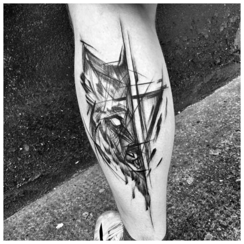 Vilko tatuiruotė ant vyro kojos