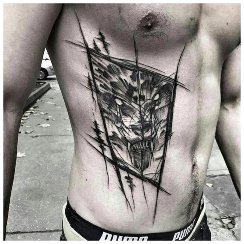 Vilko tatuiruotė ant vyro kūno