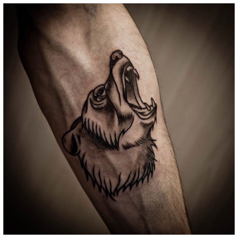Zvířecí tetování na předloktí muže