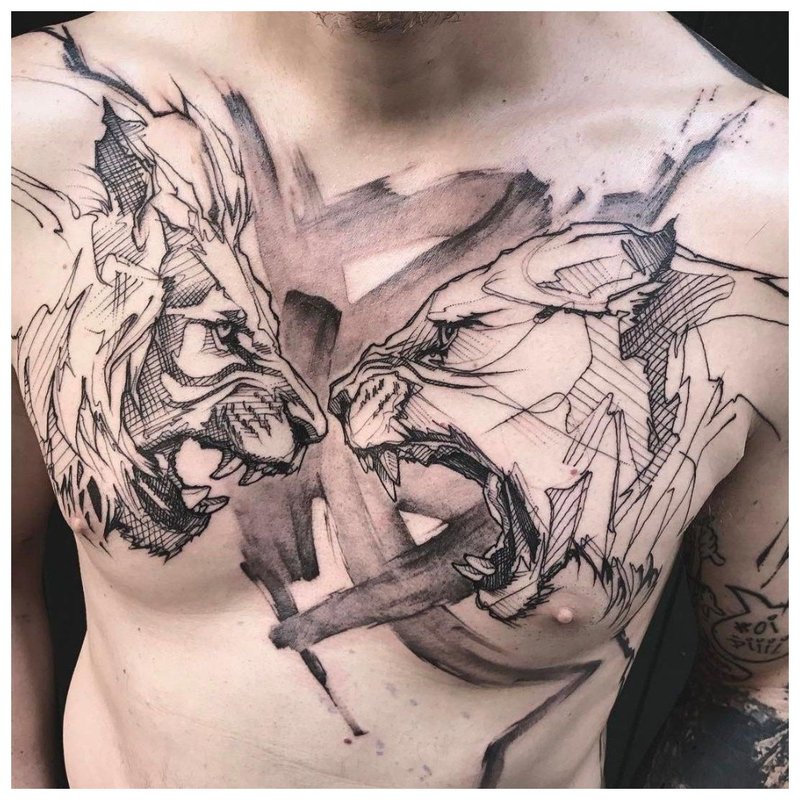 2 rozzlobená zvířata - tetování na lidské hrudi