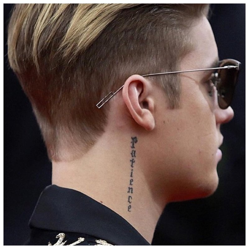 Tattoo inscription on the neck