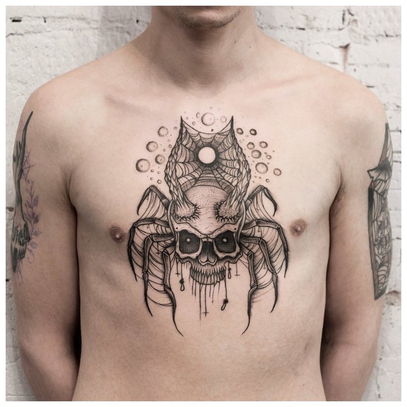 Tatuaż pająka w stylu zrób to sam na piersi mężczyzny